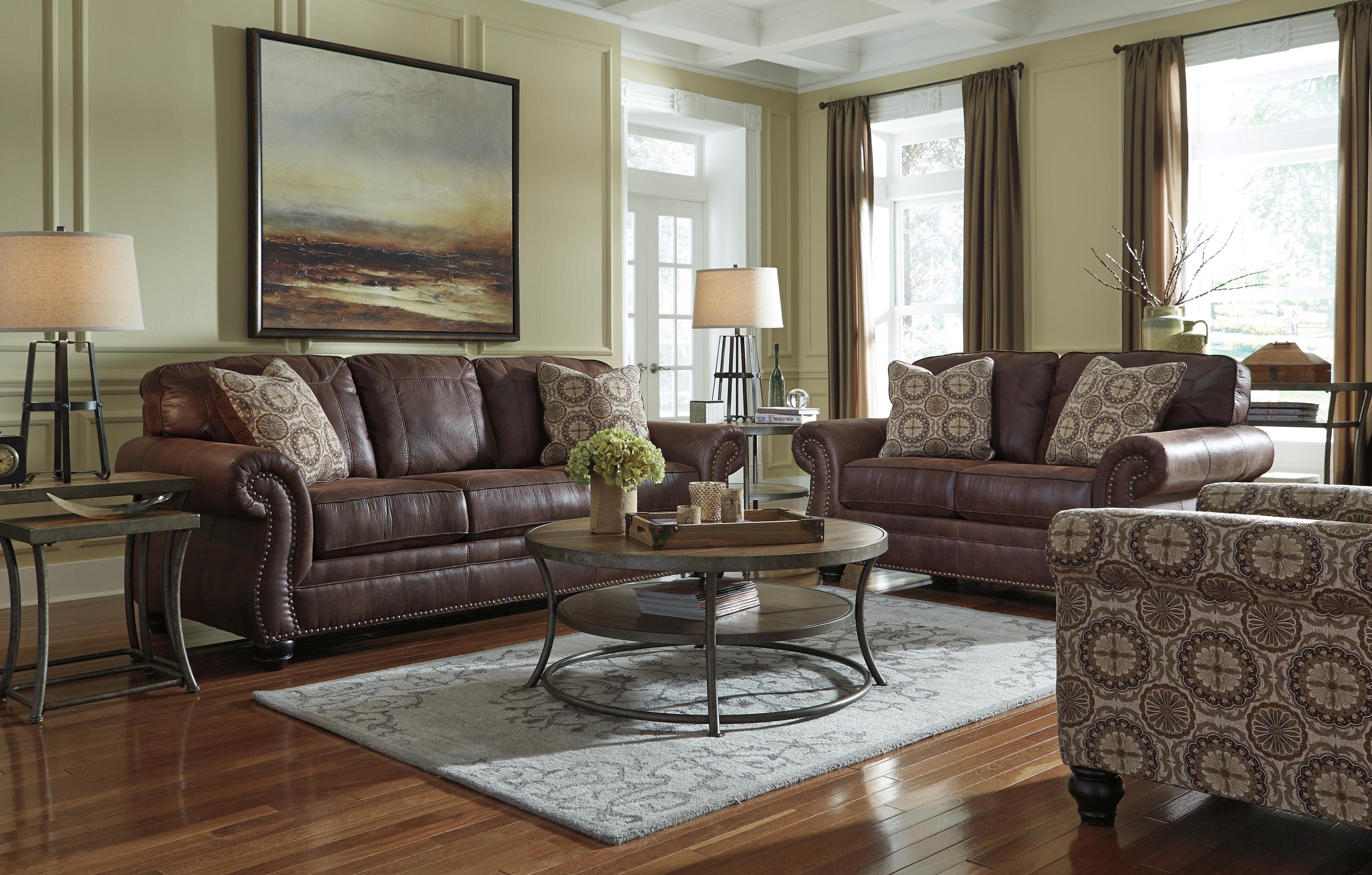 Benchcraft Breville Faux Leather Sofa with Rolled Arms and Nailhead